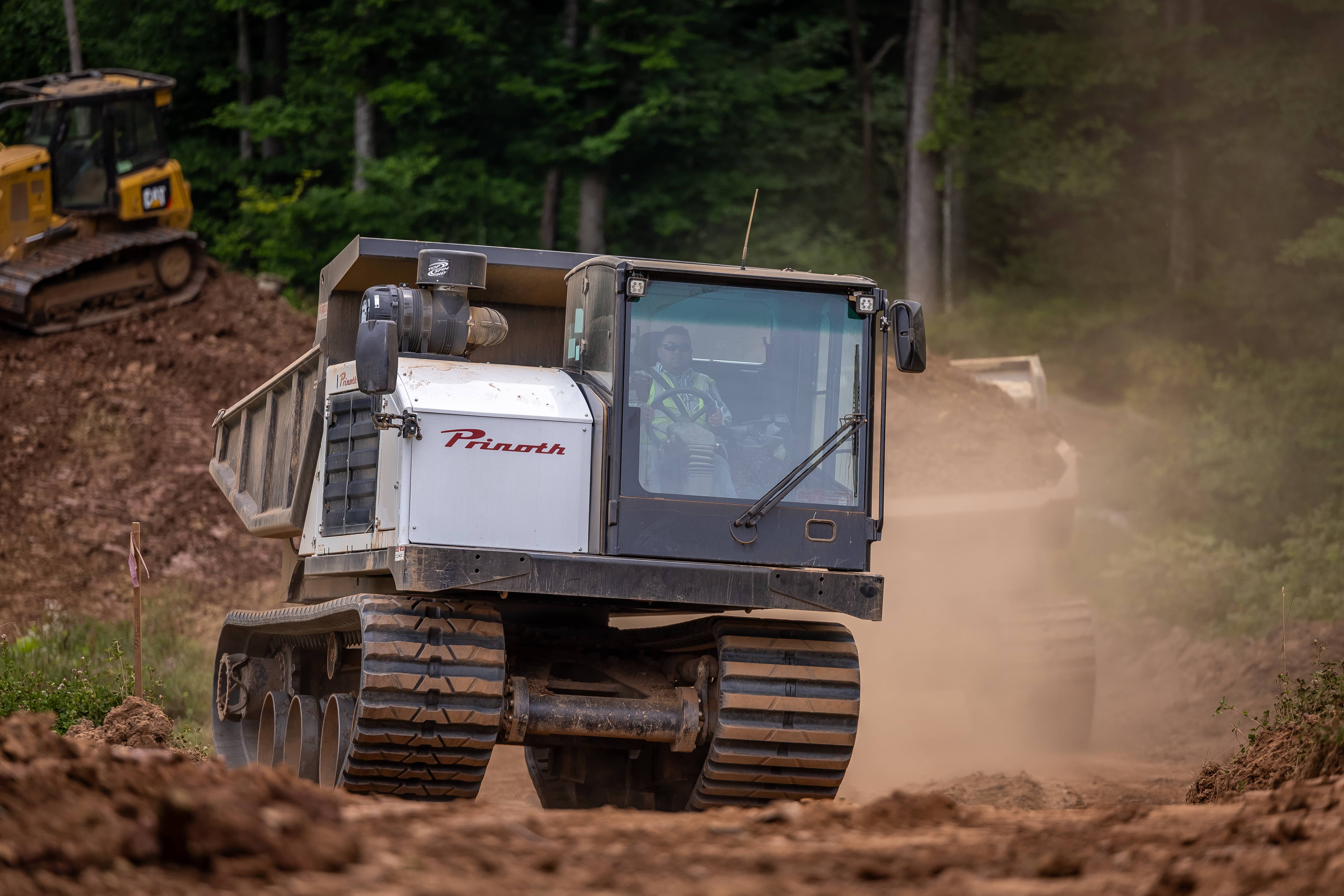 Prinoth crawler carrier on a steep construction site, demonstrating off-road capability.