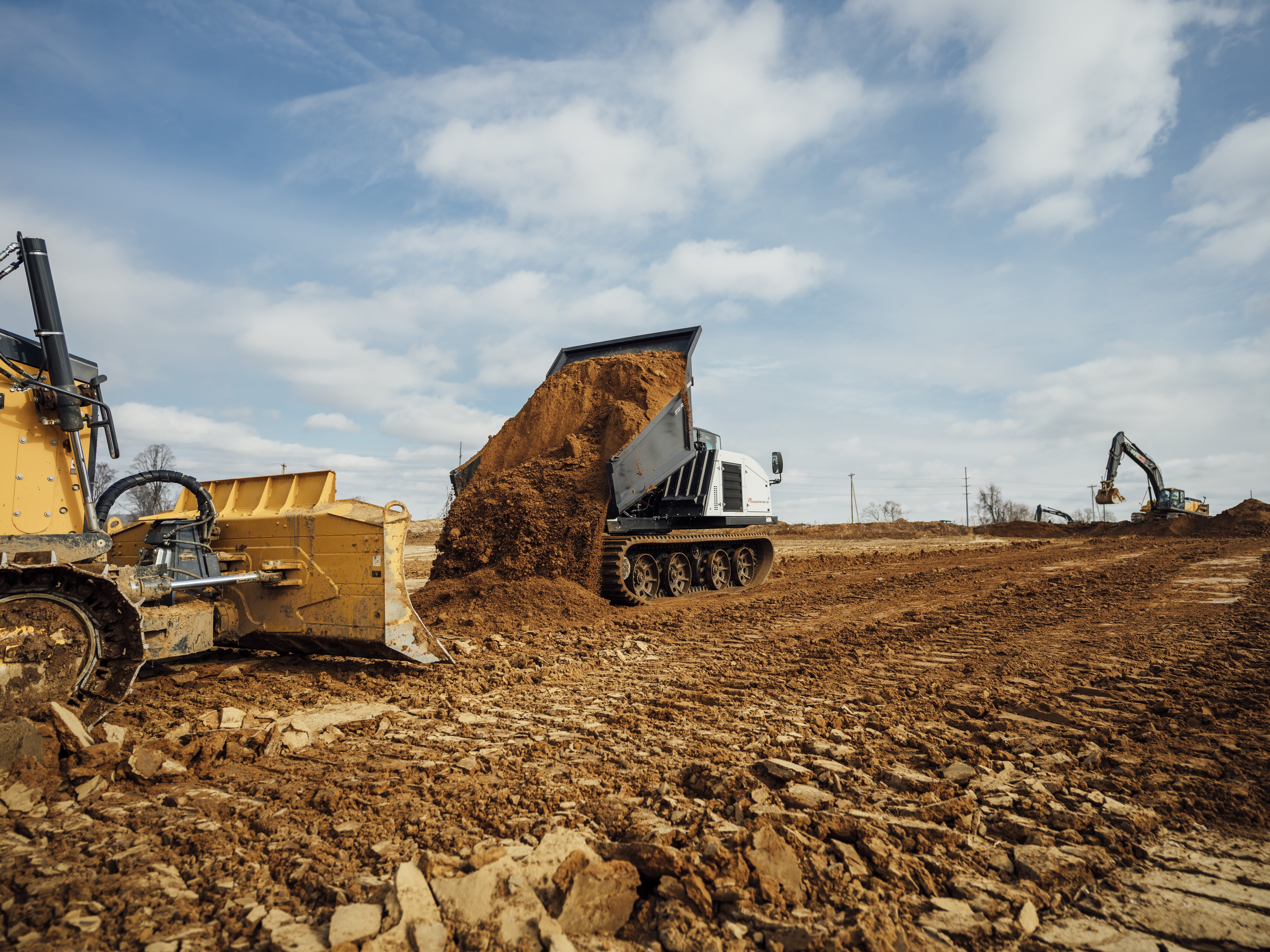 Spin. Dump. Done. Faster cycles, safer operators, and maximum efficiency on every haul