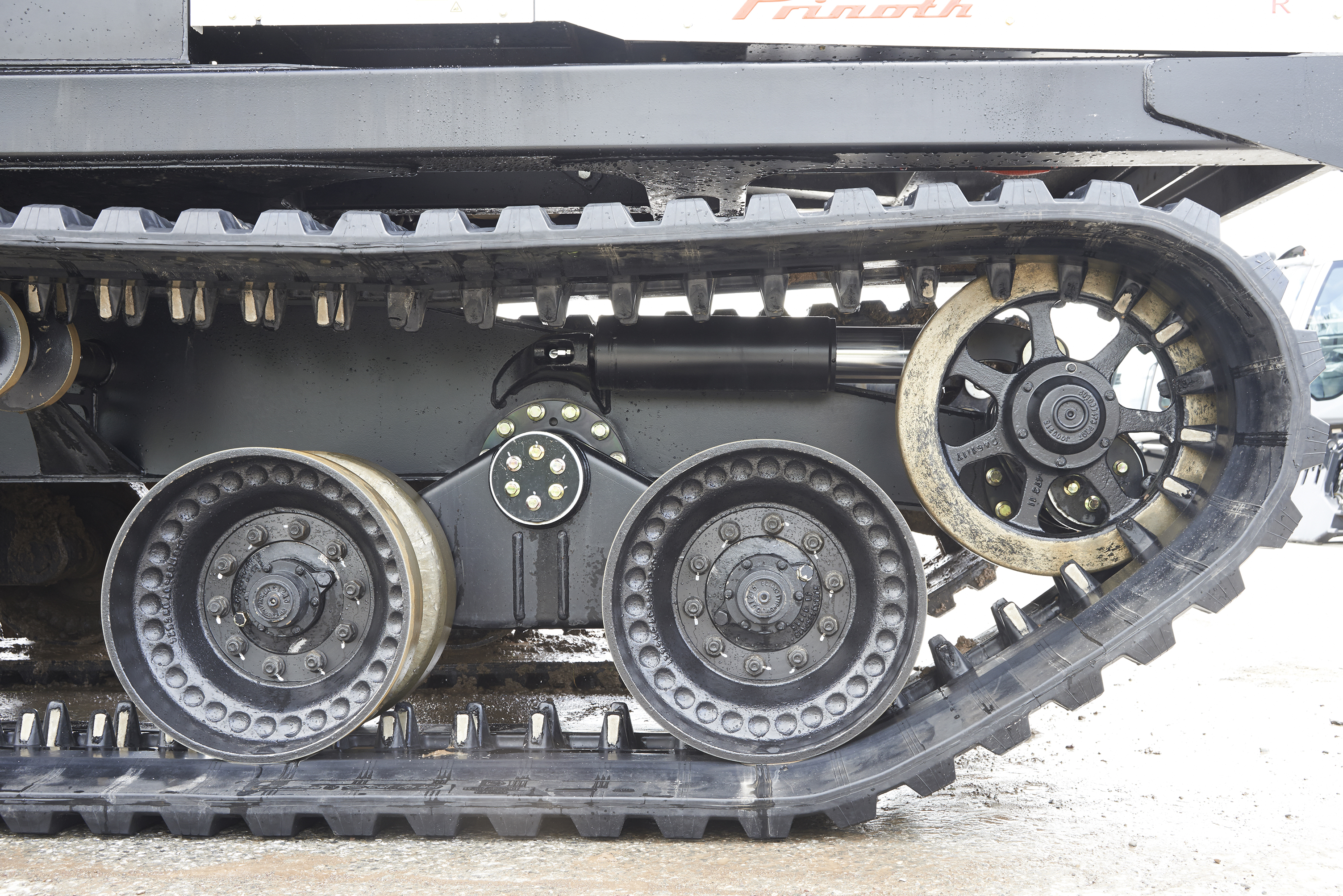 Automatic track tensioning system eases track care Automatic track tensioning system eases track care